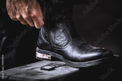 leather boots on valise