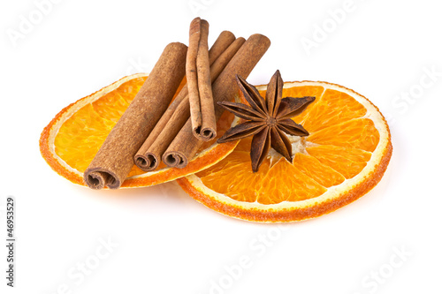 orange slices, cinnamon and anise isolated on white