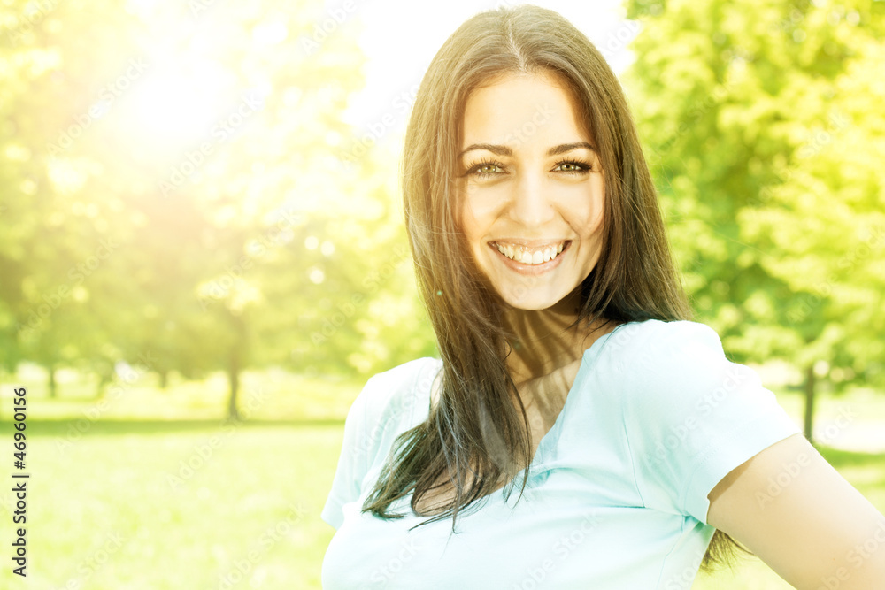 happy young woman enjoying on beautiful spring day in park happy young woman enjoying on beautiful spring day in park