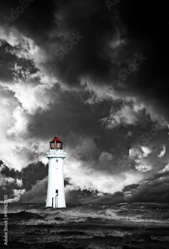 Lighthouse with approaching dramatic storm clouds