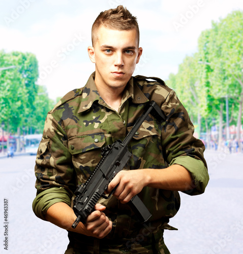 handsome soldier holding gun