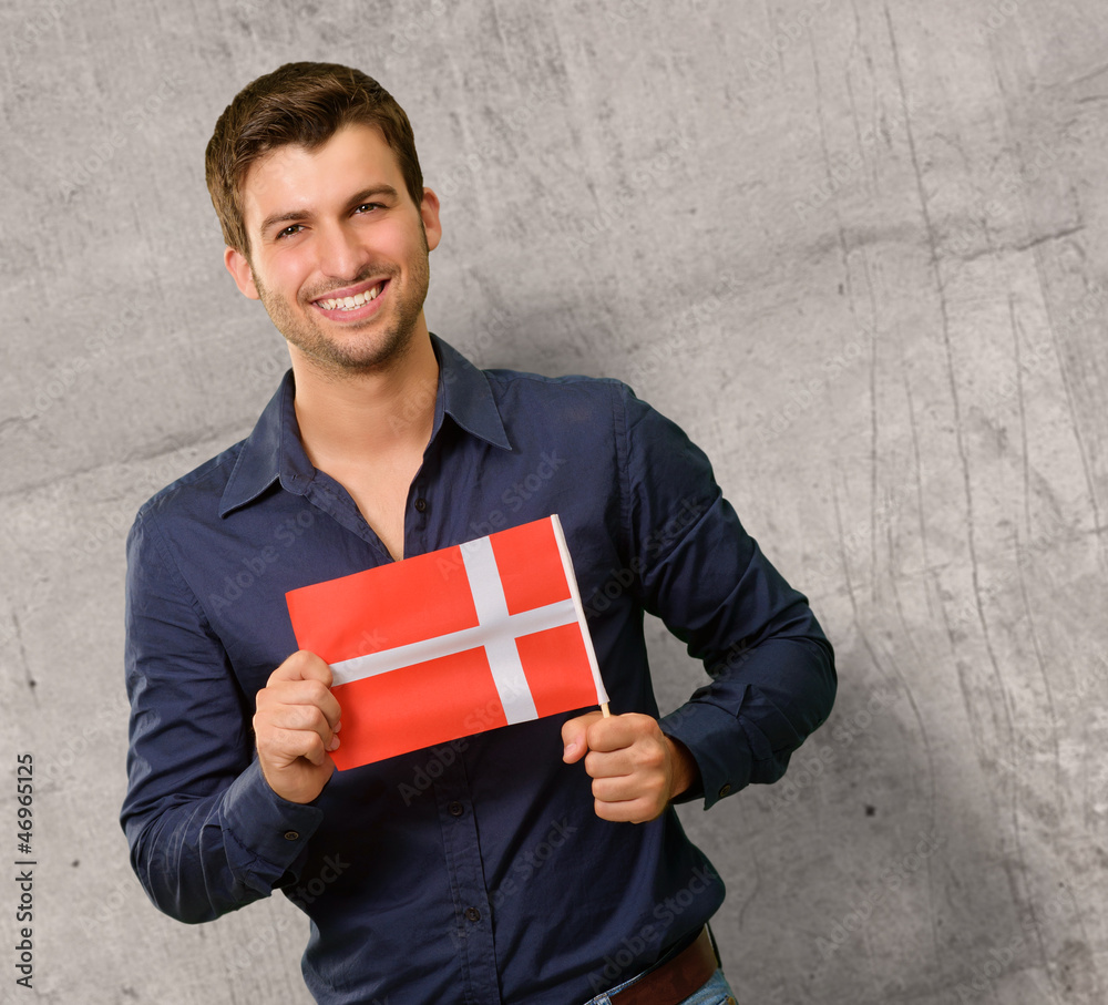 Potrait of a young man holding flag Potrait of a young man holding flag