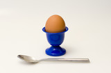 Blue cup with egg and spoon