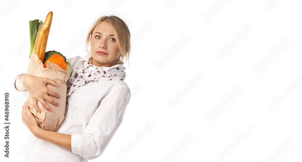 Attractive woman holding a bag of useful food Attractive woman holding a bag of useful food