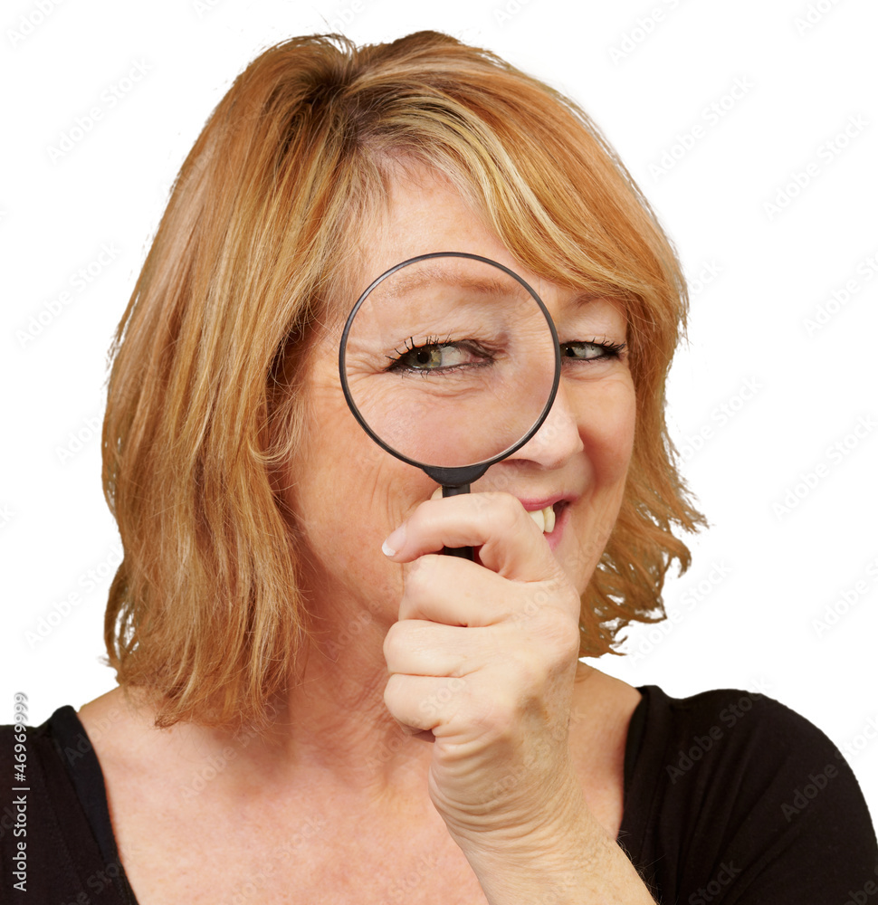 Woman using a magnifying glass Woman using a magnifying glass