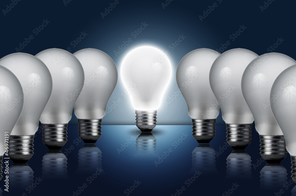 Incandescent light bulb in a row with middle one on Incandescent light bulb in a row with middle one on