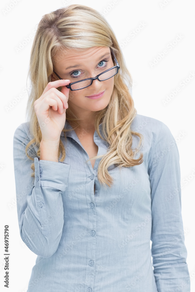 Woman looking above her glasses Woman looking above her glasses