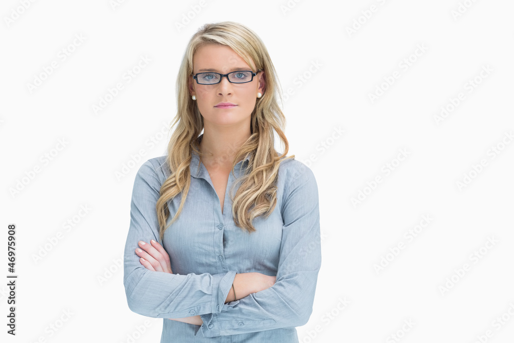 Woman wearing glasses while crossing arms Woman wearing glasses while crossing arms