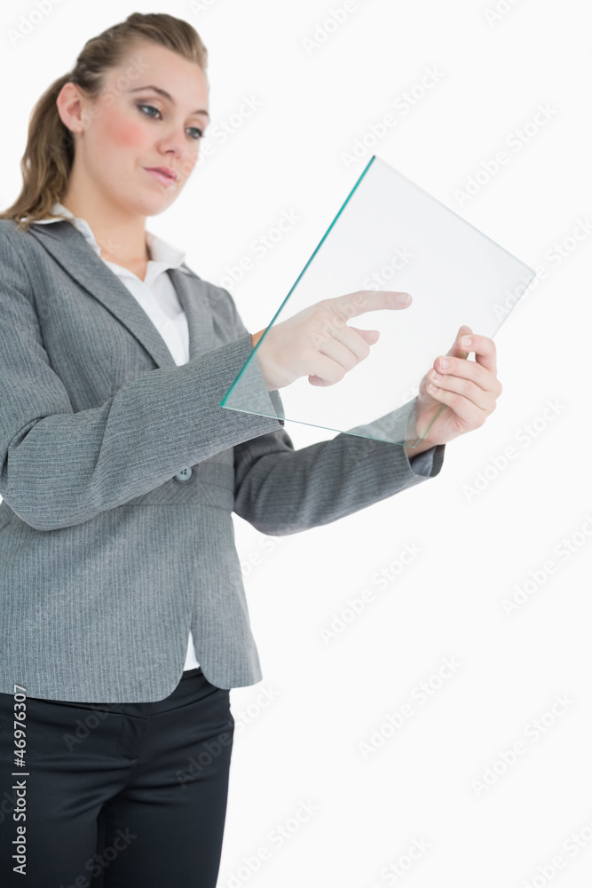Businesswoman pointing at something on the pane Businesswoman pointing at something on the pane