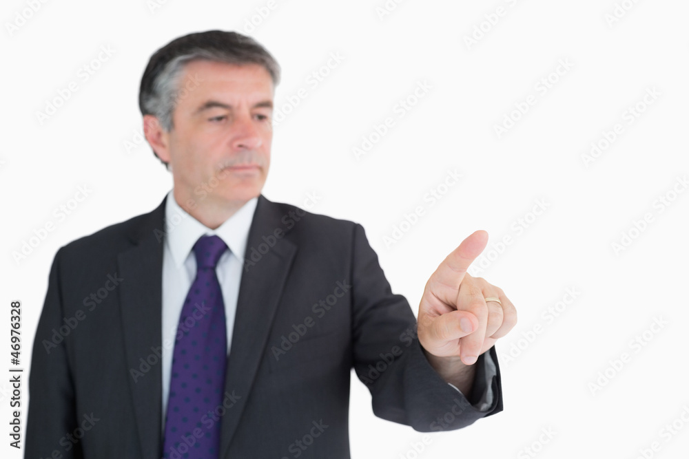 Businessman pressing on something Businessman pressing on something