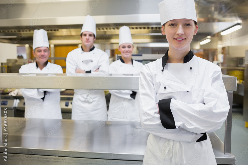 Chef standing with her arms crossed