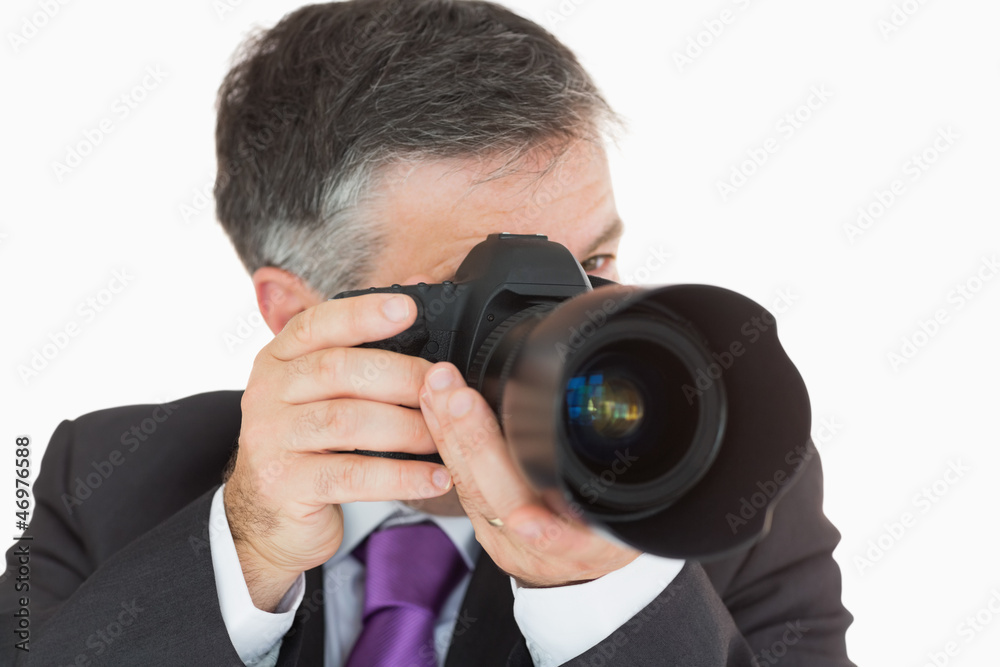 Businessman taking a photo Businessman taking a photo