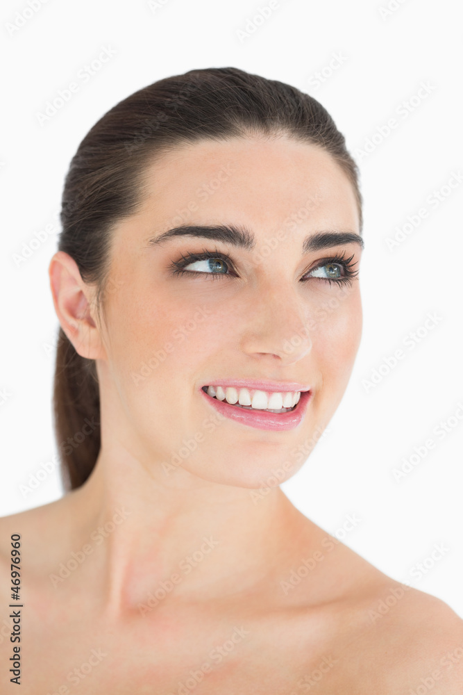 Woman looking up while smiling Woman looking up while smiling