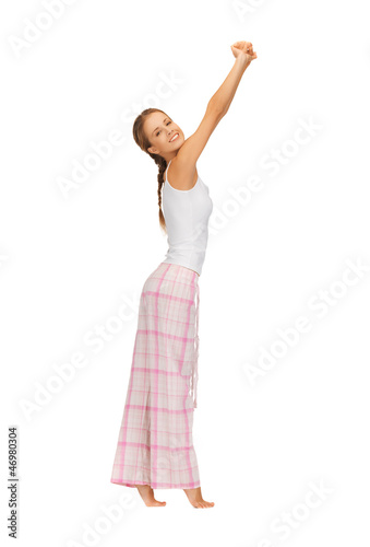 woman in pajamas doing morning exercise