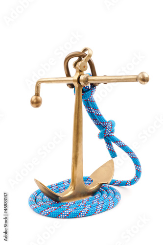 old marine anchor and blue rope