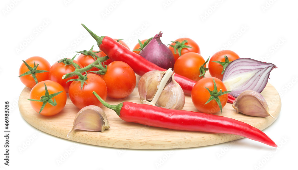 fresh vegetables on a cutting board on a white background fresh vegetables on a cutting board on a white background