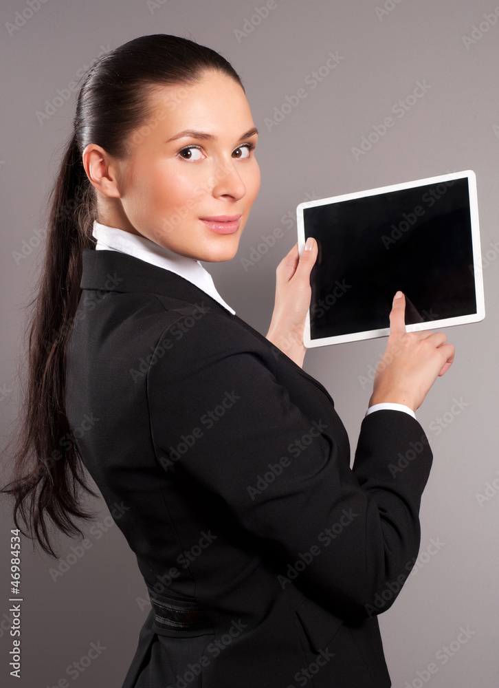 A young businesswoman holding her digital tablet pc A young businesswoman holding her digital tablet pc