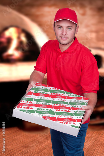 Boy delivering a pizza box photo