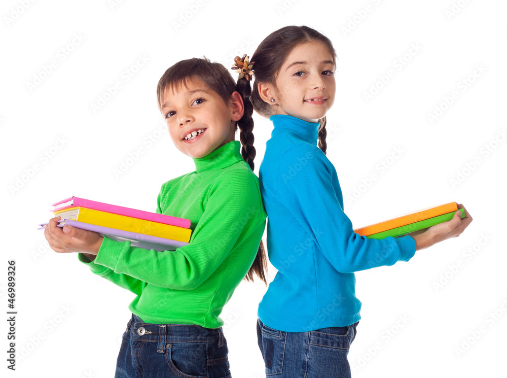 Kids standing with stack of books Kids standing with stack of books