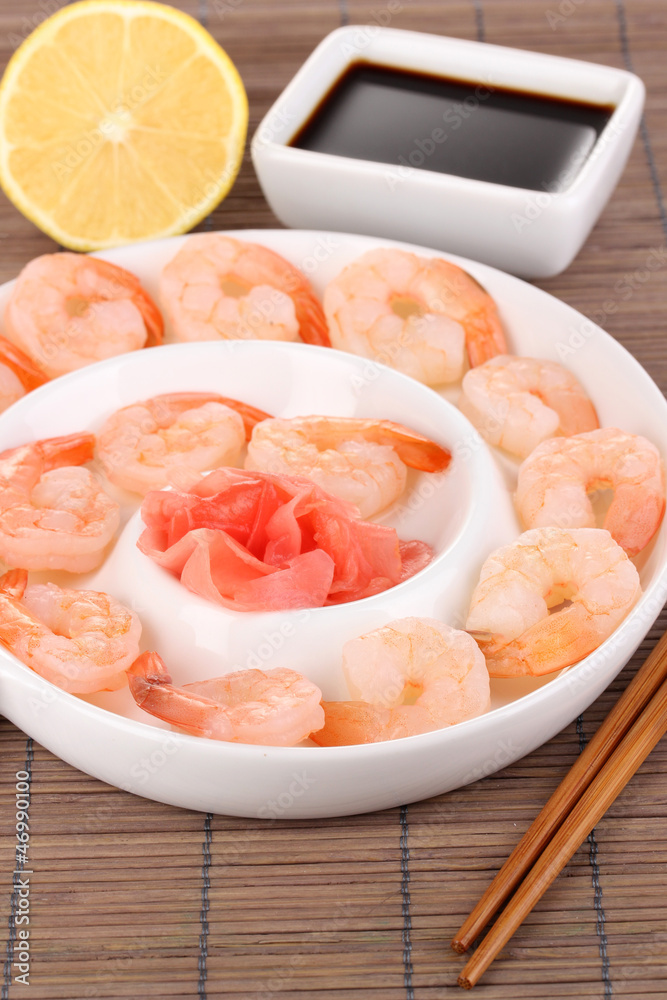 Prawns on plate with chopsticks and sauce Prawns on plate with chopsticks and sauce