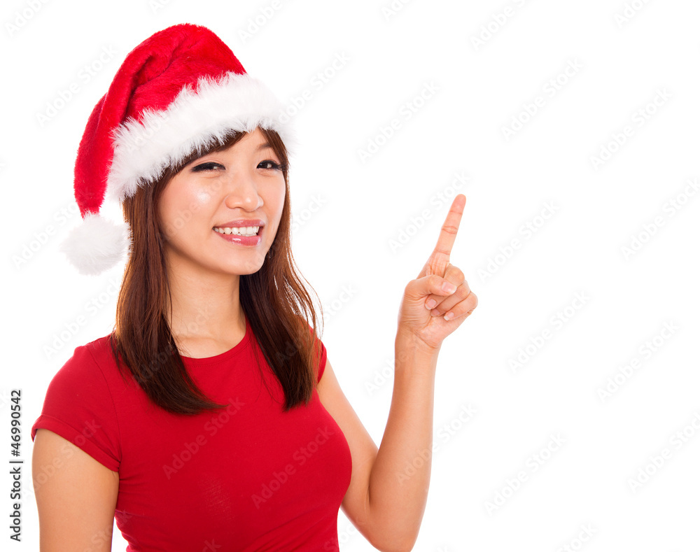 Christmas girl pointing on blank space