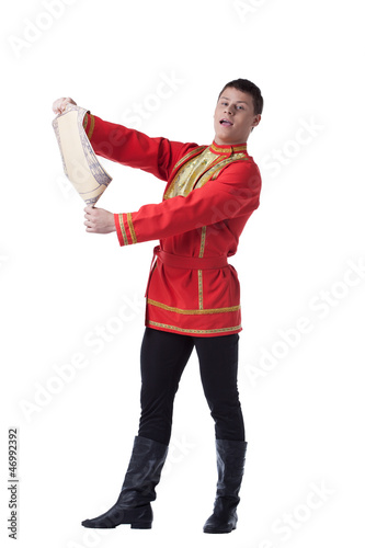 Dancer in russian costume with paper