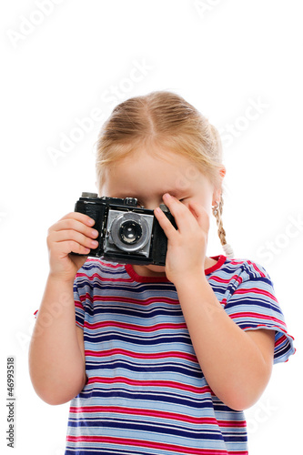 Little girl with old camera.