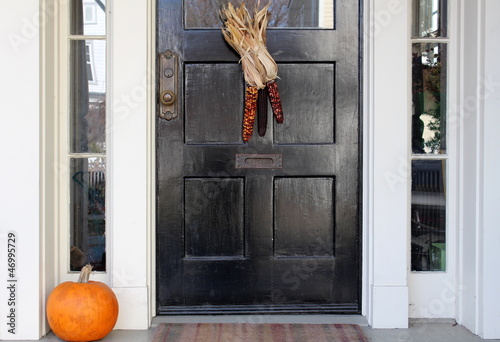 Εκτύπωση καμβά Black door with indian corn and pumpkin on doorstep