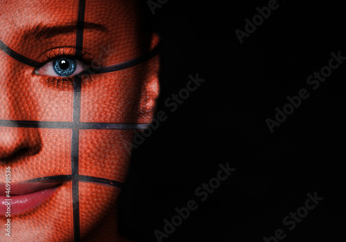 Basketball pattern on woman face photo