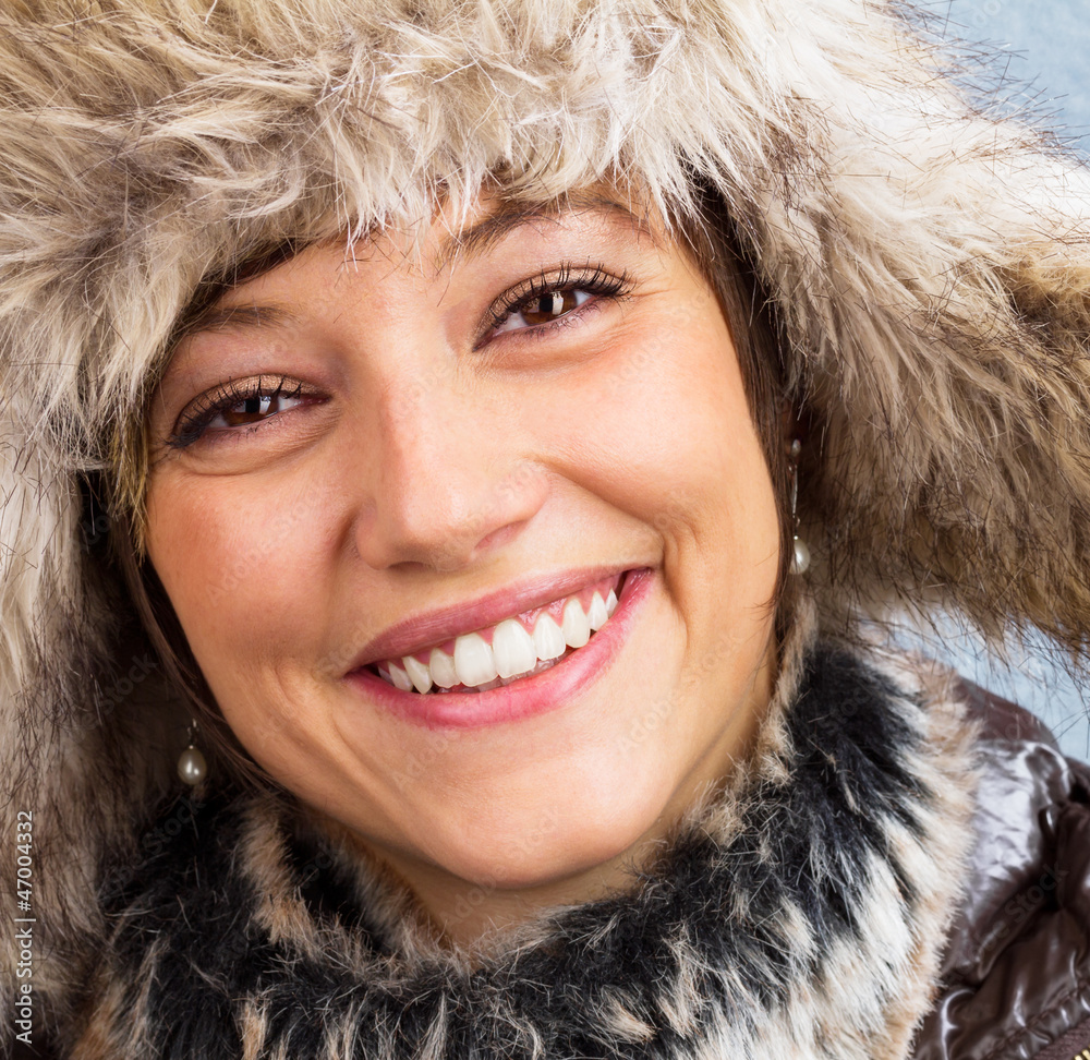 Happy laughing beautiful woman with fur hat Happy laughing beautiful woman with fur hat