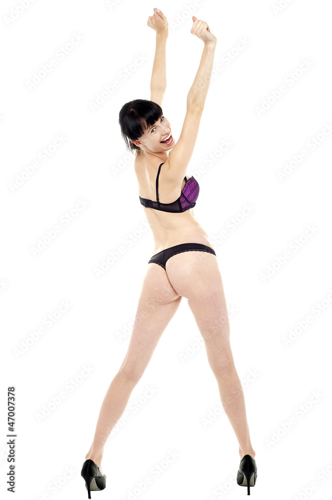 Jubilant bikini model turning back. Full length shot Jubilant bikini model turning back. Full length shot
