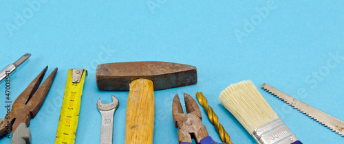 various construction work tools on blue