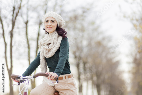 Young woman on the bicycle