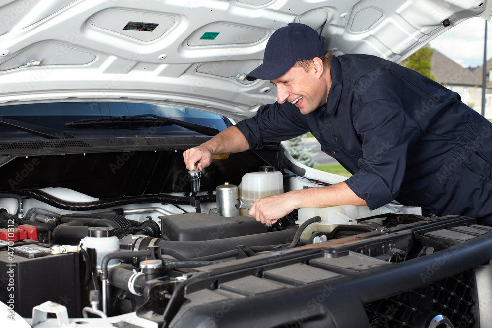 Car mechanic working in auto repair service. Car mechanic working in auto repair service.