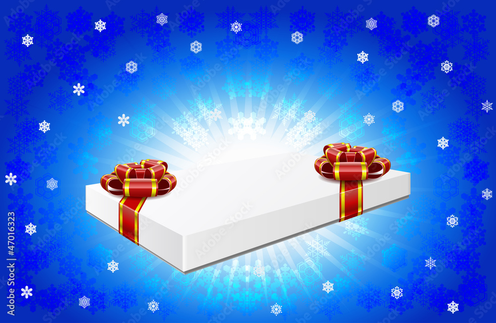Gift box is on winter background.