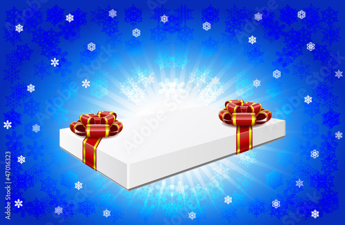 Gift box is on winter background. © fkdkondmi
