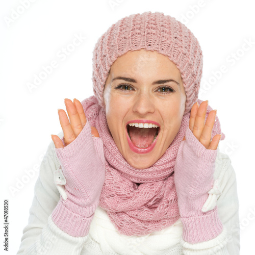 Happy woman shouting through megaphone shaped hands