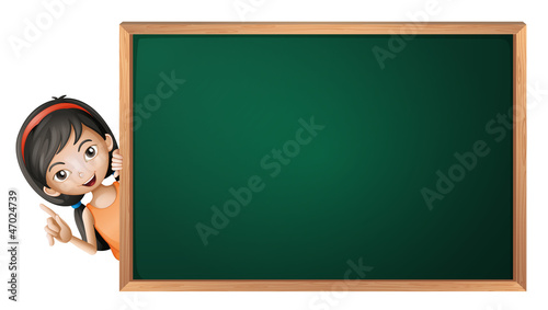 a girl and a green board
