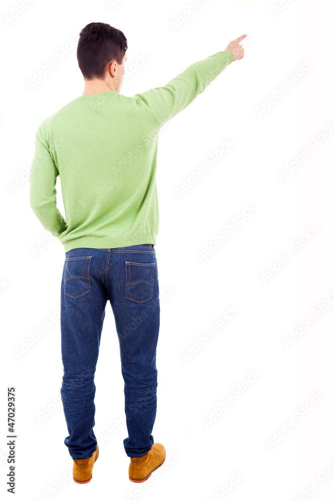 Young casual man pointing at something over white background Young casual man pointing at something over white background