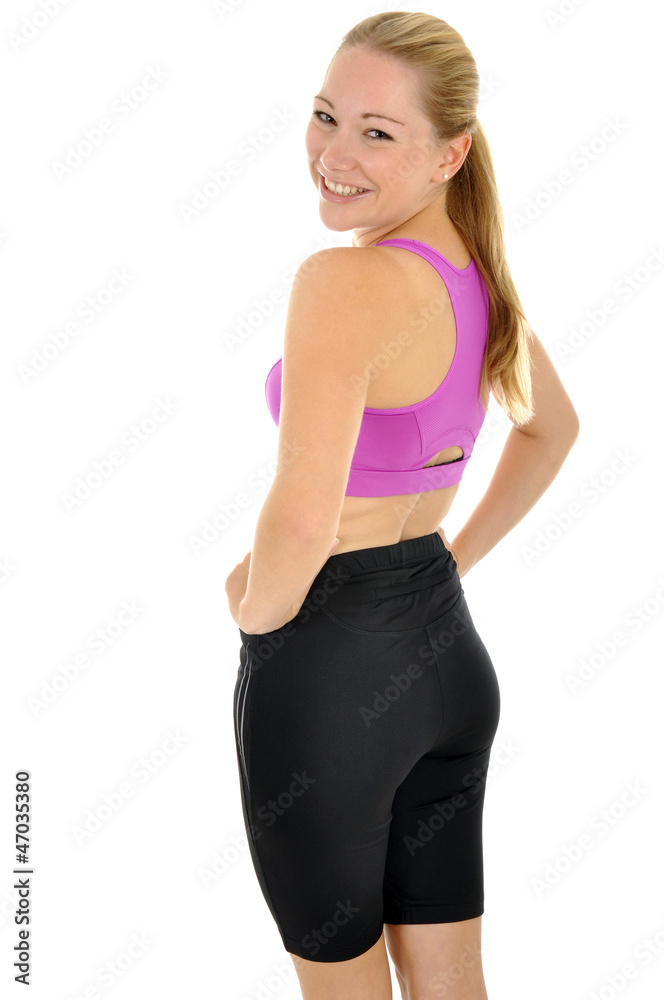 Junge Frau in Sportdress lacht