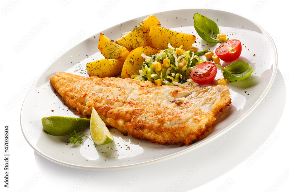 Fish dish - fried fish fillet with vegetables Fish dish - fried fish fillet with vegetables