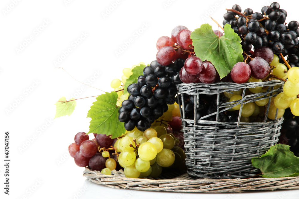 assortment of ripe sweet grapes in basket, isolated on white. assortment of ripe sweet grapes in basket, isolated on white.