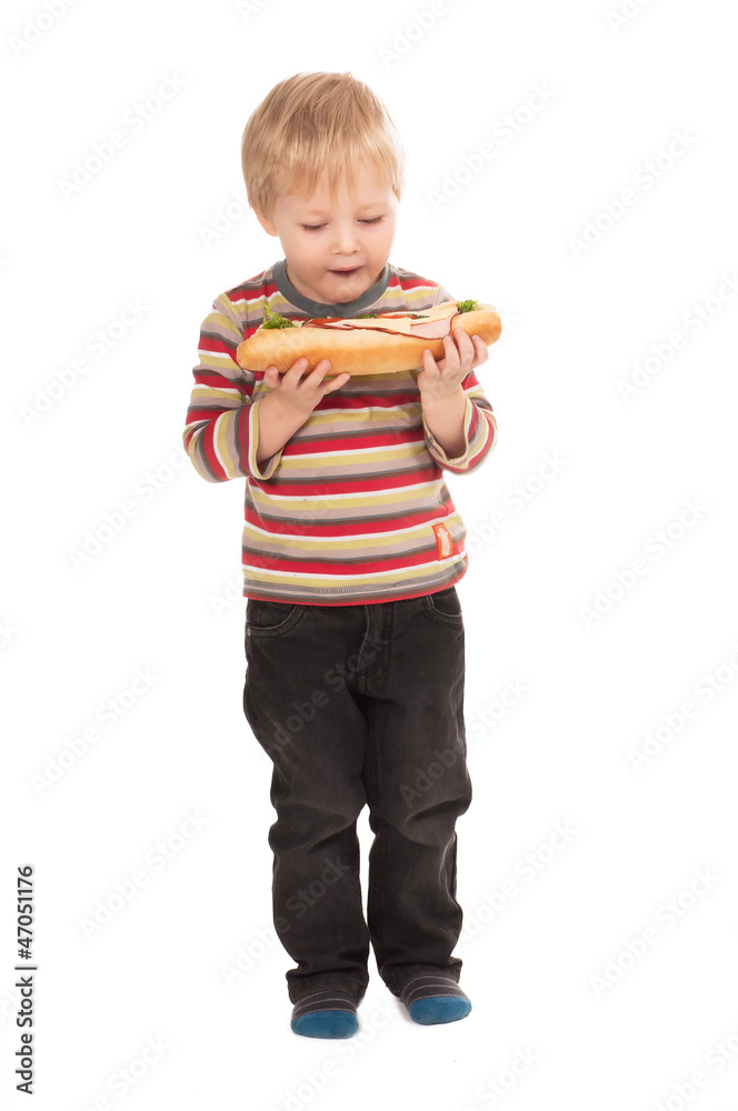 boy with large sandwich on white background