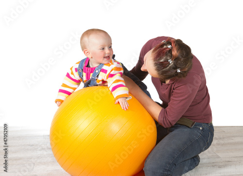 Devoted mother exercising her baby