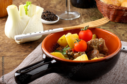 Meat stew with boiled potatoes and tomato