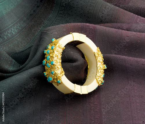Картината върху платно Luxury ivory bracelet decorated by gold and turquoise.