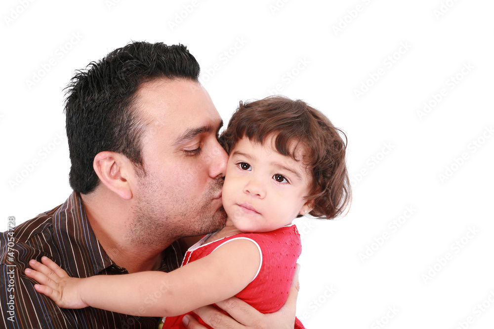 Father hugging and kissing little daughter, smiling. Father hugging and kissing little daughter, smiling.