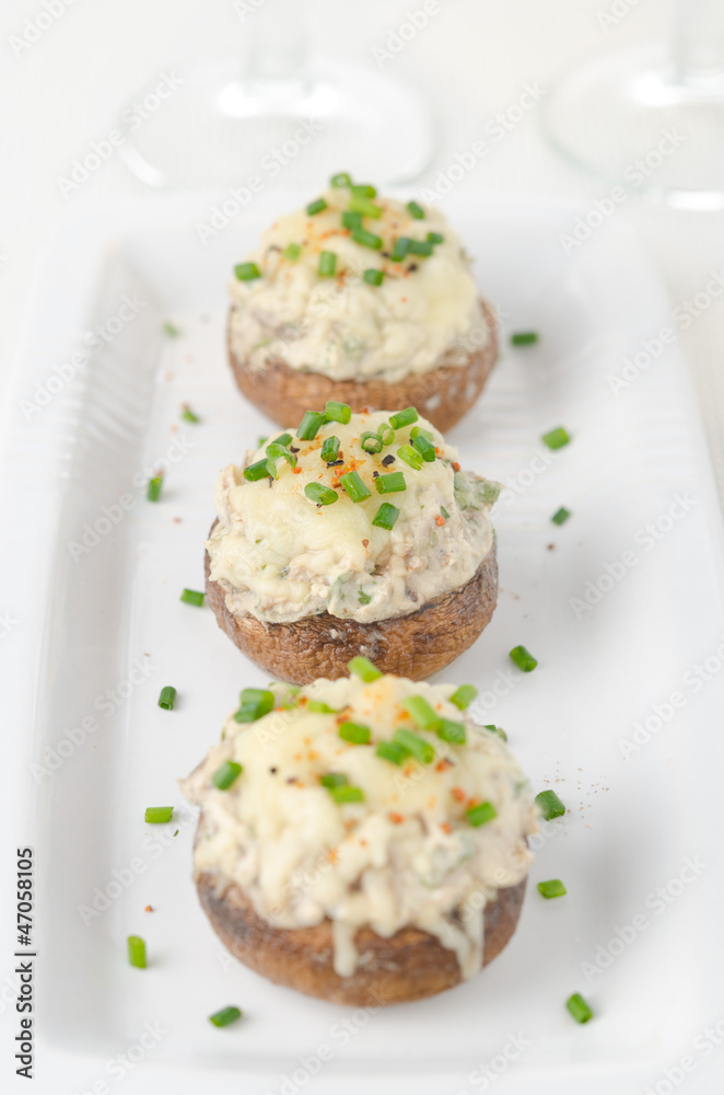 Stuffed mushrooms, baked with cheese and herbs, selective focus Stuffed mushrooms, baked with cheese and herbs, selective focus