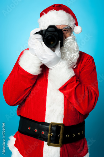 Santa Claus turns into a pro photographer © stockyimages