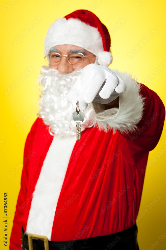 Aged Santa dangling a key Aged Santa dangling a key